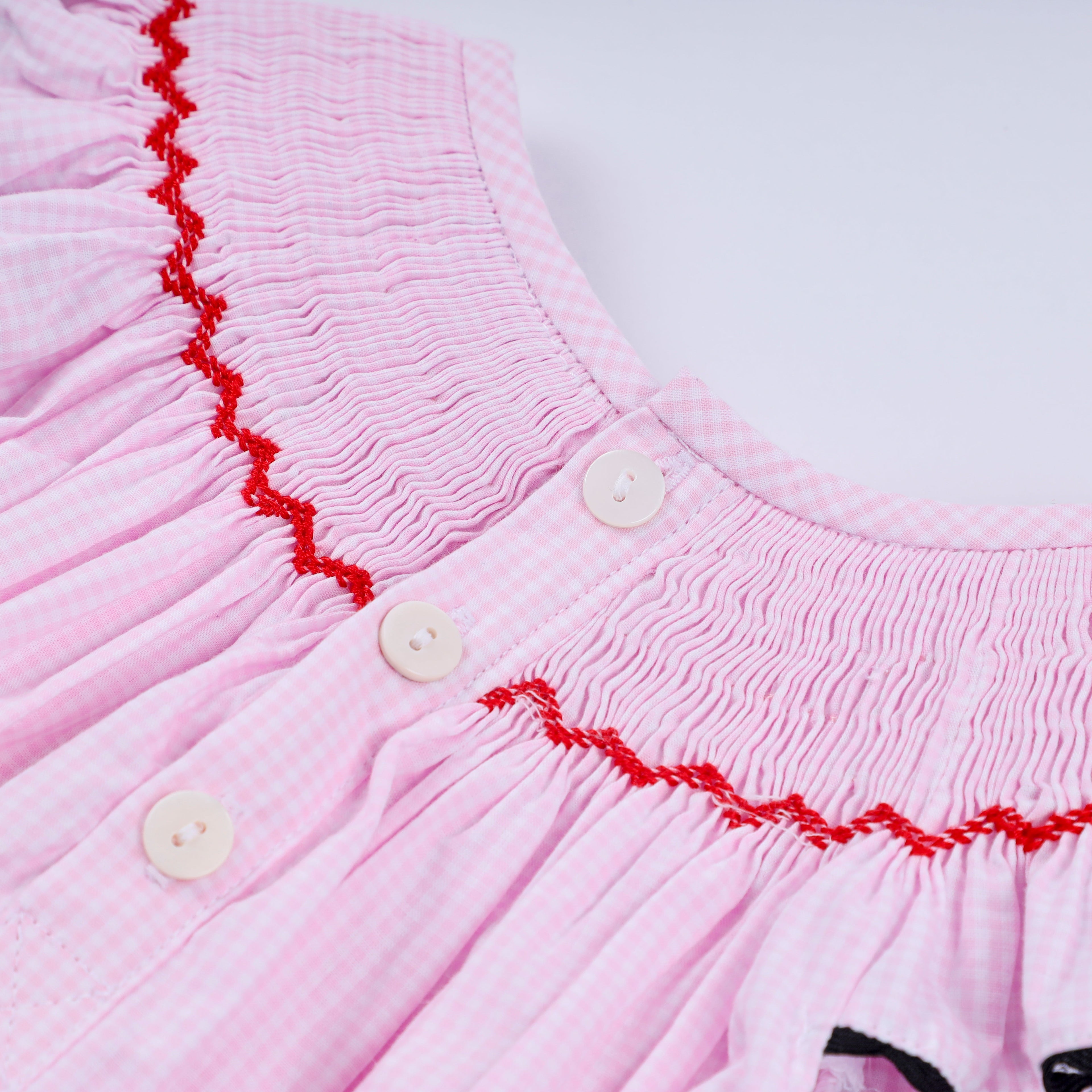 Red character hand smocked plaid ruffle bubble
